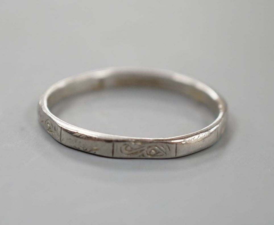 A white metal (stamped platinum) wedding band, size K